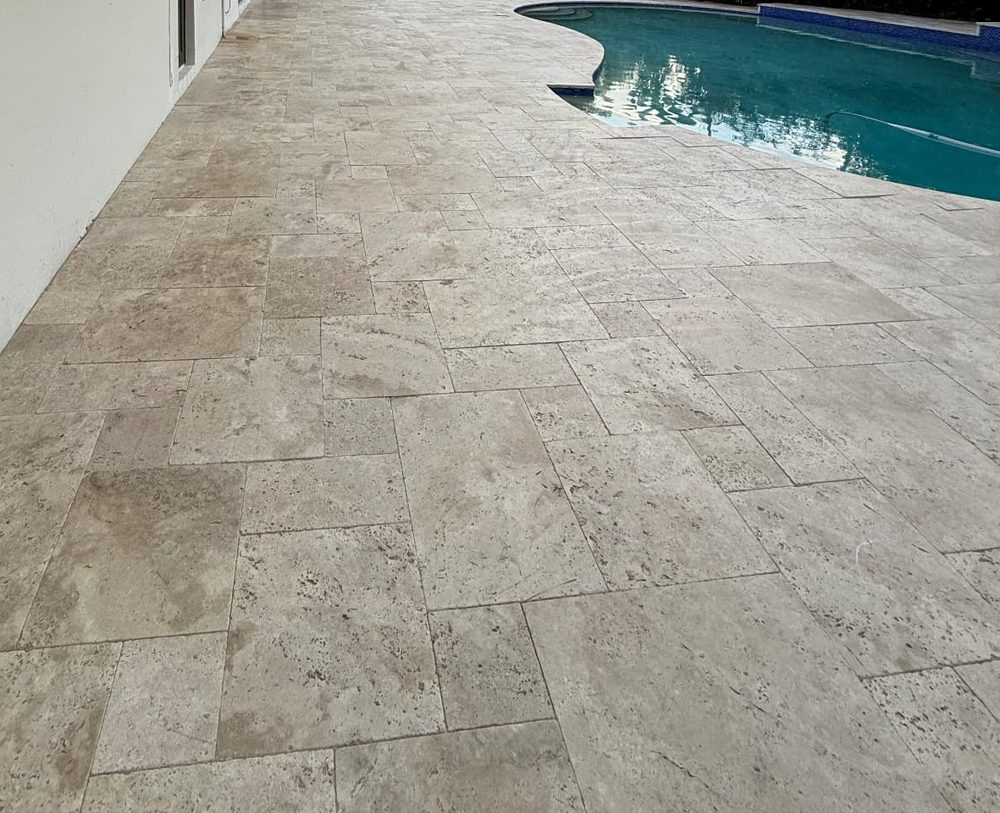 Pool patio — weeds, dirt, and staining cleaned out of the pavers and joints. after